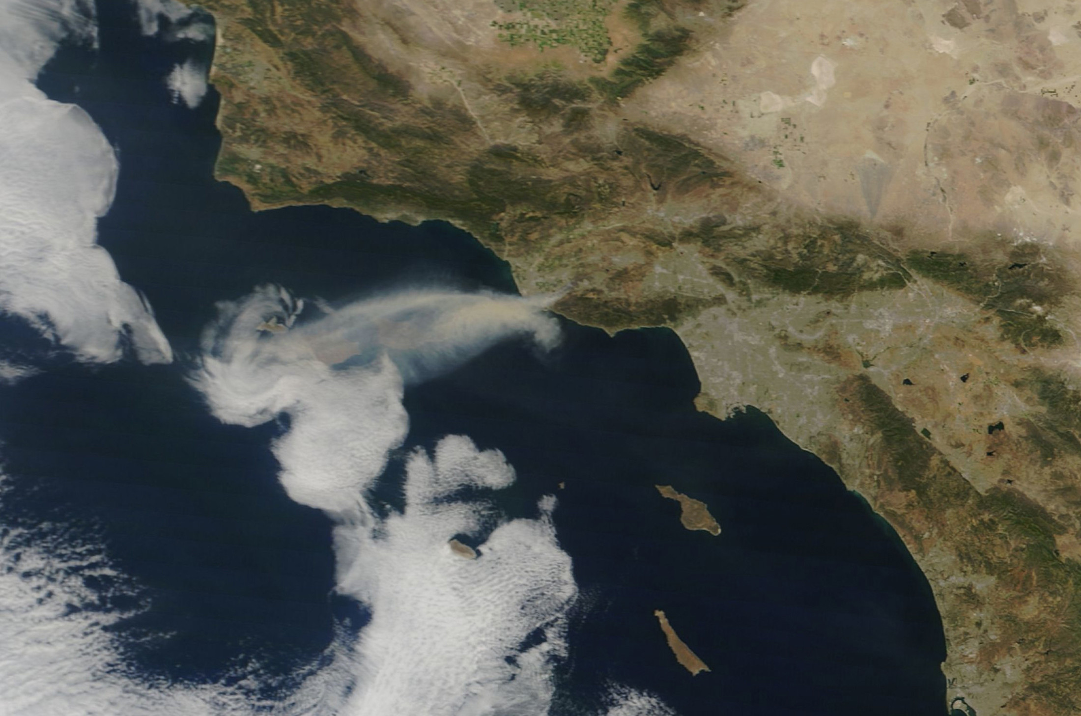 A satellite image showing smoke from the Springs Fire in Ventura County, California.